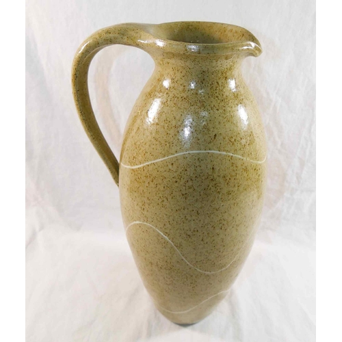 319 - Susan Cupitt (20th/21st Century)+ Tall stoneware pottery jug with mottled green glaze and porcelain ... 