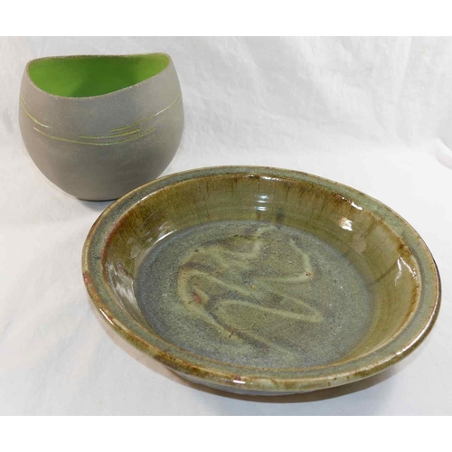 323 - Betty May (20th/21st Century British)+ Pottery bowl with matt grey exterior and green interior, make... 