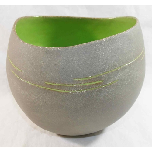 323 - Betty May (20th/21st Century British)+ Pottery bowl with matt grey exterior and green interior, make... 