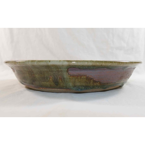 323 - Betty May (20th/21st Century British)+ Pottery bowl with matt grey exterior and green interior, make... 