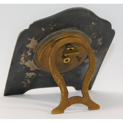 24A - A silver coloured metal and guilloche enamelled easel backed clock, the face with Arabic numerals an... 