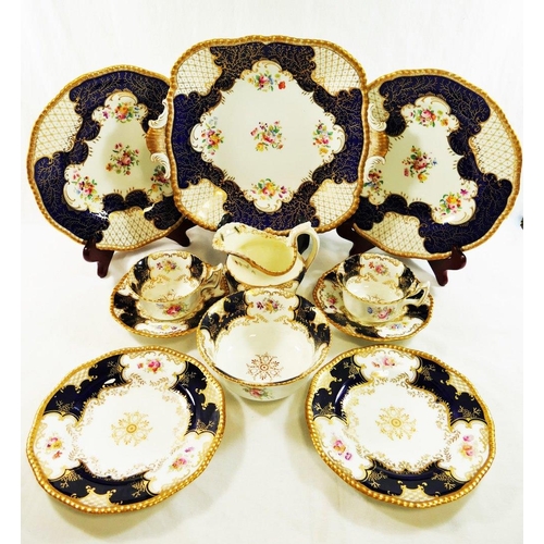 14A - A Coalport batwing pattern part tea service, with cobalt blue panels, comprised of seven cups, nine ... 