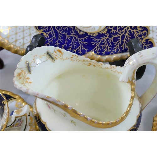 14A - A Coalport batwing pattern part tea service, with cobalt blue panels, comprised of seven cups, nine ... 