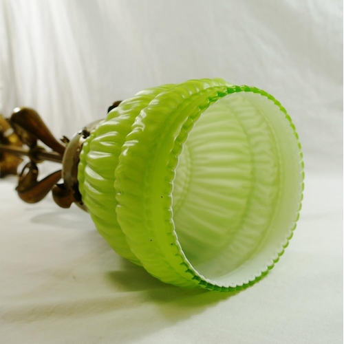22 - An Art Nouveau brass single ceiling light fitting, with original green glass shade, 69cm long