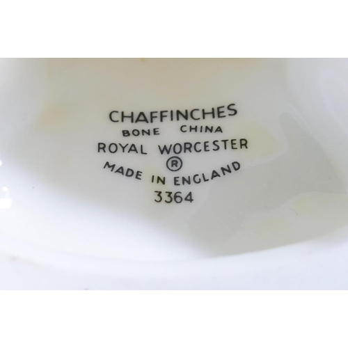 4 - A collection of ceramic bird figures and groups including a Royal Worcester porcelain bird group ent... 