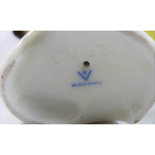 4 - A collection of ceramic bird figures and groups including a Royal Worcester porcelain bird group ent... 