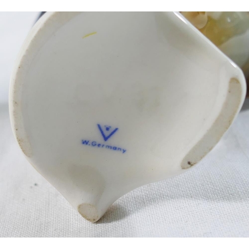 4 - A collection of ceramic bird figures and groups including a Royal Worcester porcelain bird group ent... 