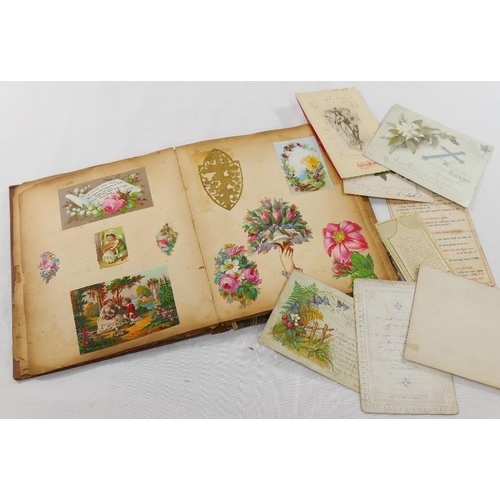 105A - A Victorian scrap album containing decoupage, greetings cards, cut out pictures, pressed flowers and... 