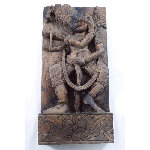 121 - A carved wooden panel of Hindu god Ganesh, 28cm high, and another Indian figural carved wooden panel... 