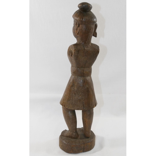 122 - An Indian carved wooden figure, moving arms lacking, 35cm high