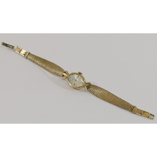 149 - A ladies Longines ladies bracelet watch, the case stamped '14K GOLD', with gold plated strap