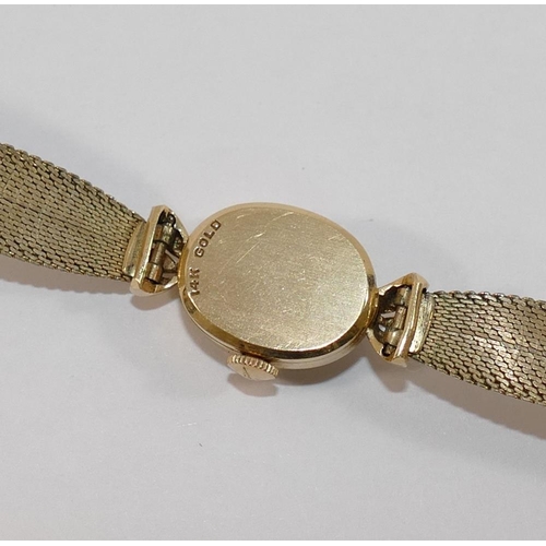 149 - A ladies Longines ladies bracelet watch, the case stamped '14K GOLD', with gold plated strap