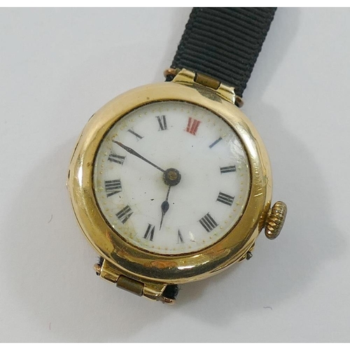 150 - A ladies 15 carat gold cased wrist watch, with white enamel dial, ribbon strap with clasp stamped '9... 