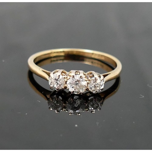 170A - A diamond three-stone ring, the graduated old-cut stones approximately 0.15, 0.23 and 0.15 carats, i... 