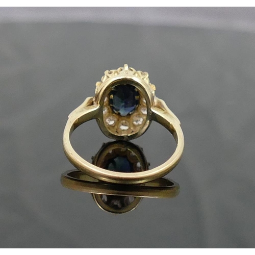 171A - A sapphire and diamond oval cluster ring, the oval mixed-cut sapphire approximately 1 carat,  claw s... 