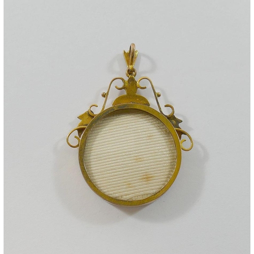 176 - A gold and half pearl set glazed circular keepsake pendant, indistinctly marked to the edge of the l... 