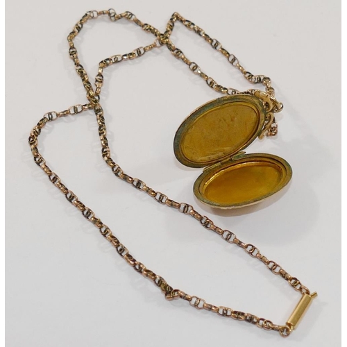 187 - A Victorian yellow metal fancy link chain with barrel clasp, 4.6g, and an oval locket with gold fron... 