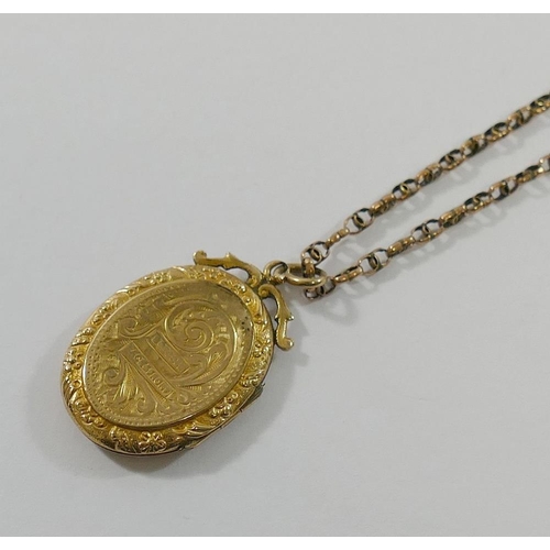 187 - A Victorian yellow metal fancy link chain with barrel clasp, 4.6g, and an oval locket with gold fron... 