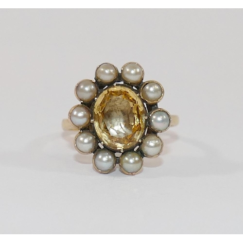 190 - A 19th century gold, yellow topaz and half pearl oval cluster ring, the oval mixed cut topaz in clos... 