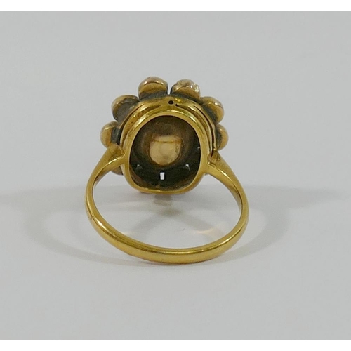 190 - A 19th century gold, yellow topaz and half pearl oval cluster ring, the oval mixed cut topaz in clos... 