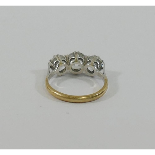 191 - A 9 carat gold diamond simulant three-stone ring, the stones claw-set in white to a yellow shank, fi... 