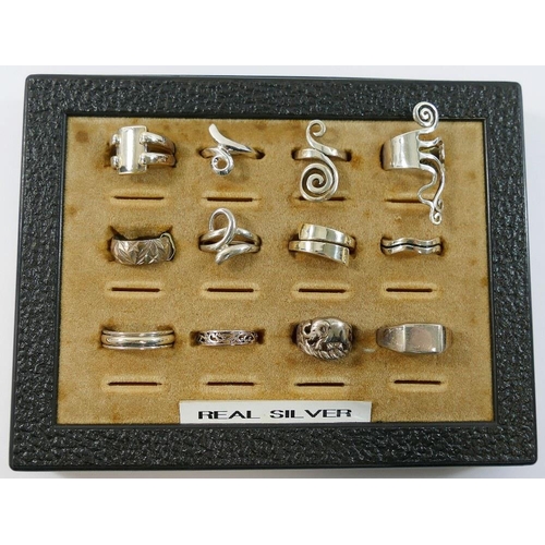 204 - Twelve modern silver and other rings stamped '925' or 'silver', various designs and sizes

We are pl... 