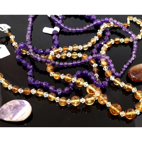 207 - A collection of amethyst and citrine set  jewellery, the amethyst jewellery comprised a faceted bead... 