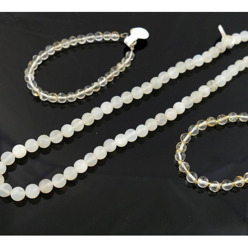 210 - A selection of moonstone jewellery comprised of a cylindrical bead necklace with a matching pair of ... 