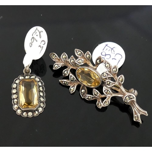 232 - An amethyst and marcasite floral spray brooch and a selection of citrine and marcasite jewellery inc... 