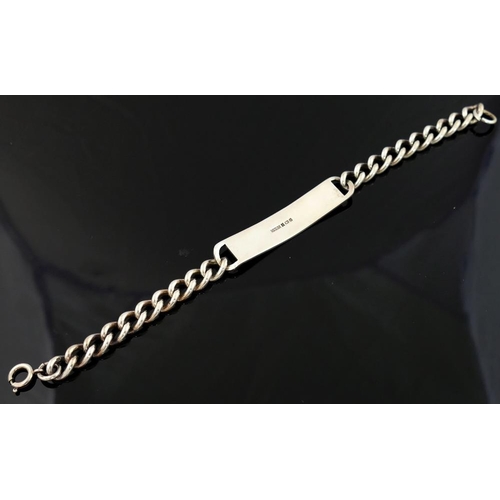 233 - A silver curb link identity bracelet the rectangular panel 11mm wide

We are pleased to be offering ... 