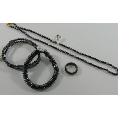 240 - A quantity of hematite jewellery comprised of two bracelets, an individually knotted beaded necklace... 