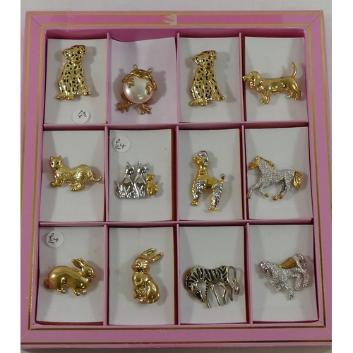 247 - 60 gold plated, paste set and other costume brooches, housed in presentation boxes.

We are pleased ... 