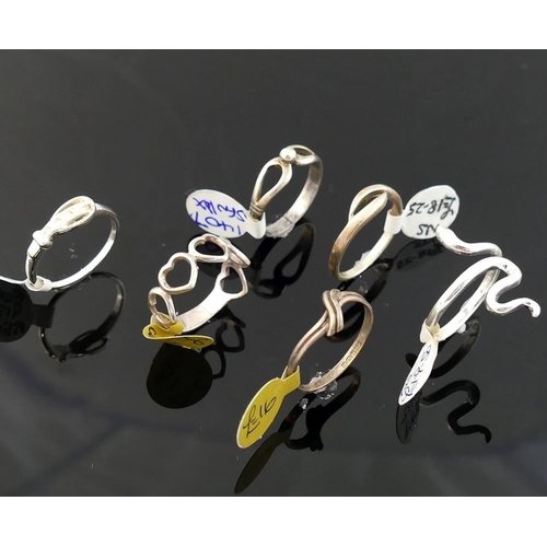 254 - Twelve modern silver and other rings stamped '925' or 'silver', various designs and sizes.

We are p... 