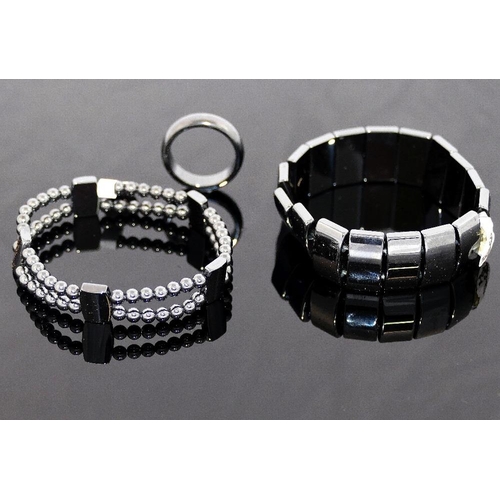 259 - A quantity of hematite jewellery comprised of two bracelets, an individually knotted beaded necklace... 