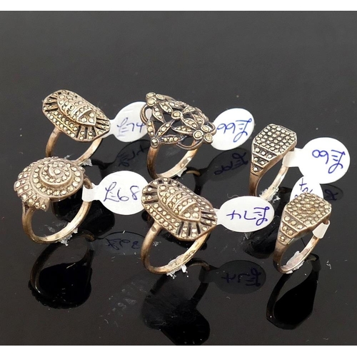 264 - A collection of 12 marcasite set rings, most stamped 'silver' or '925', including a range of sizes a... 