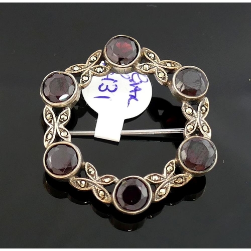 265 - A selection of garnet jewellery comprised of a circular brooch also set with marcasite, three pairs ... 