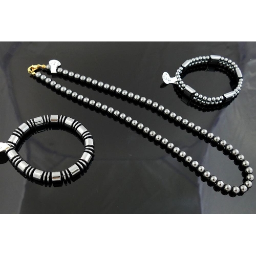 269 - A quantity of hematite jewellery comprised of two bracelets, a bead necklace, two pairs of drop earr... 