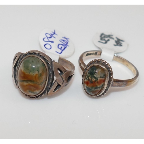 286 - A selection of moss agate jewellery comprised of two brooches, a pair of cuff-links, four rings and ... 