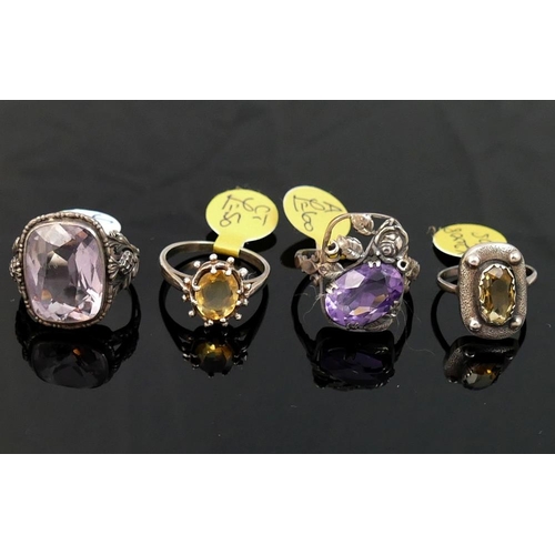 288 - A collection of 12 amethyst and citrine set rings, including some set with marcasite, most stamped '... 