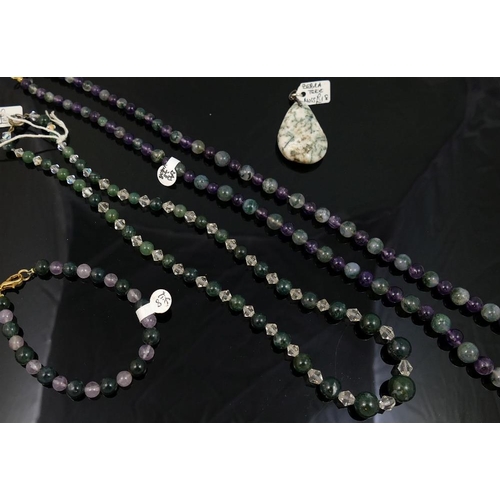 296 - A selection of moss agate jewellery comprised of a string of moss agate and amethyst graduated spher... 