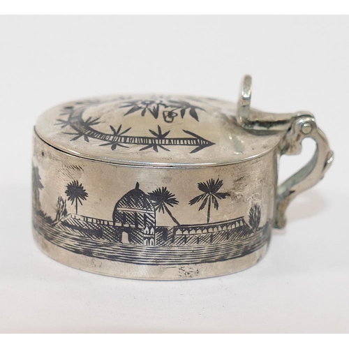 301 - An Iraqi silver and niello salt and mustard pot decorated with sailing boats, with two matching spoo... 