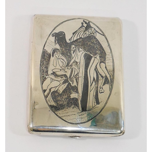 303 - An Iraqi silver and niello cigarette case decorated with a camel and traders to one side and a bridg... 