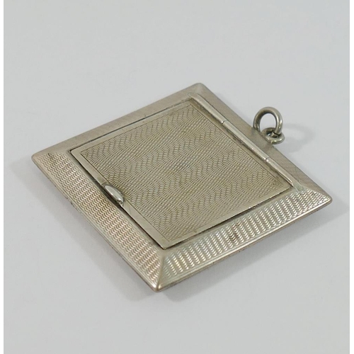 310 - Two small silver items with engine turned decoration, comprised of a small square powder compact, Bi... 