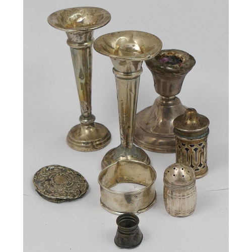 317 - A pair of silver candlesticks with weighted bases, a pair of small silver trumpet-shaped vases, also... 