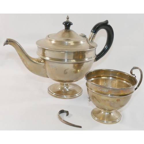 326 - A silver teapot with ebonised handle and knop, and matching sugar bowl, Birmingham 1856, combined we... 