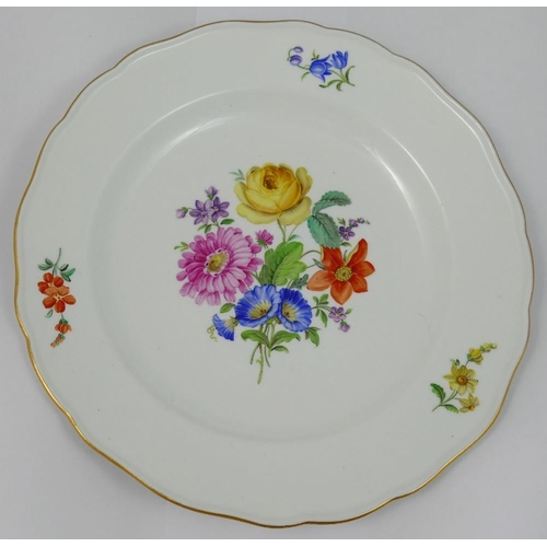 350 - A set of four Meissen style porcelain soup plates, hand painted with floral sprays, with wavy gilt r... 