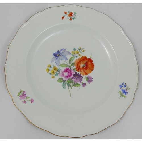 350 - A set of four Meissen style porcelain soup plates, hand painted with floral sprays, with wavy gilt r... 