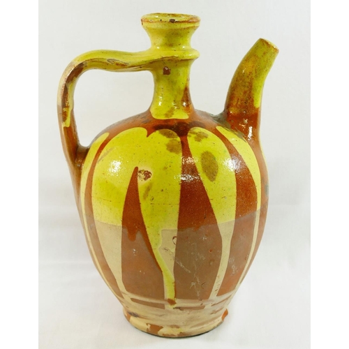 359 - A Turkish Canakkale pottery brown glazed ewer, 32cm high, and another Turkish pottery yellow and bro... 