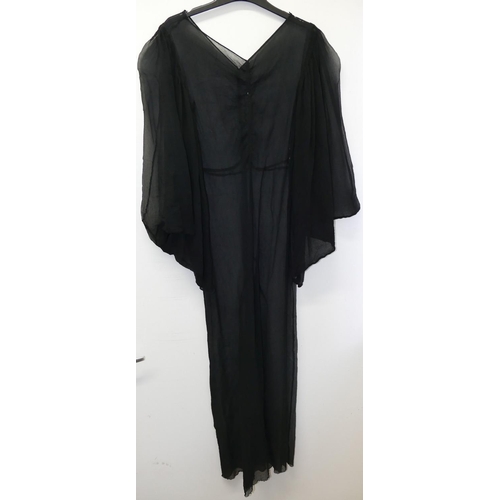 401 - A vintage full length black slip dress, a black sheer full length dress and one other vintage black ... 