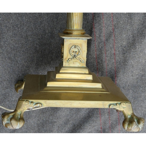 134 - An early 20th century brass telescopic Corinthian column standard lamp, raised on square base with l... 